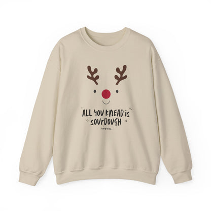 Beige sweatshirt with a reindeer face and text on a white background